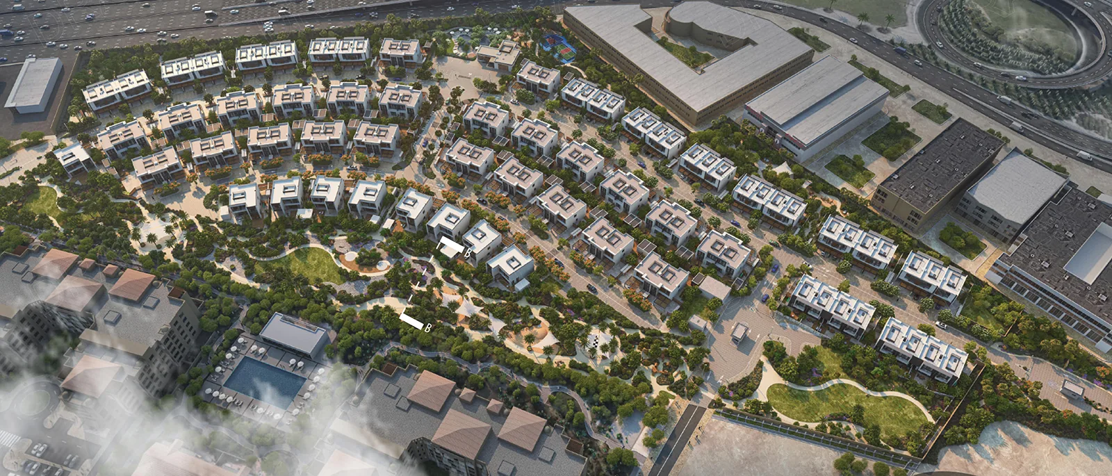 Aerial visual of the whole neighbourhood: villas along the shared streets and the wadi park running through